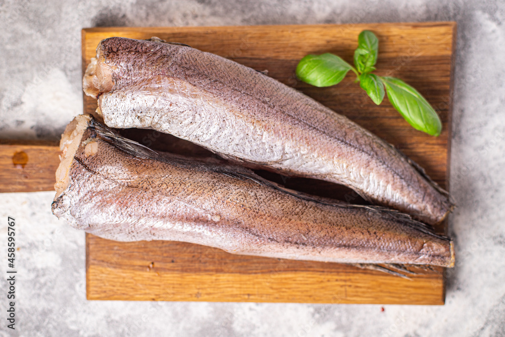 hake raw fish white fillet seafood fresh ready to eat meal snack on the table copy space food background rustic keto or paleo food pescetarian diet hake raw fish white fillet seafood fresh ready to eat meal snack on the table copy space food background rustic keto or paleo food pescetarian diet