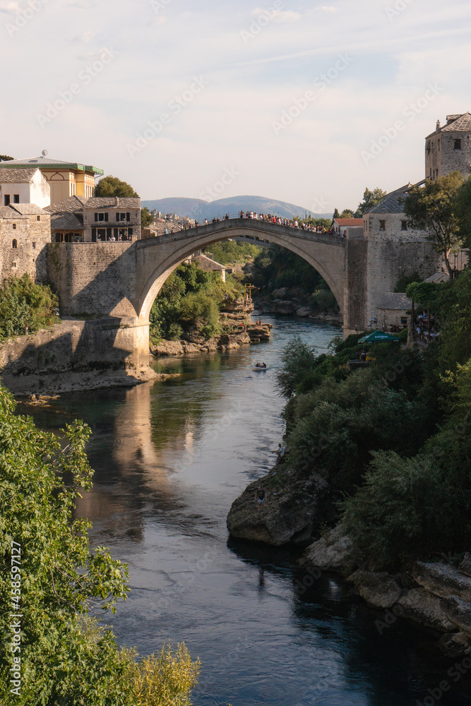 Mostar, Bosnia and Herzegovina - September 12 2021:View over Mostar Bridge - Stari Most during a sunny day, famous touristic destination in Bosnia and Herzegovina, Europe