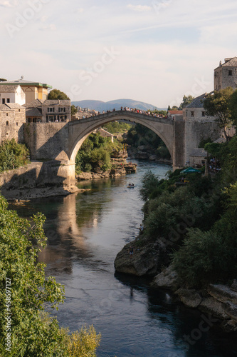 Mostar, Bosnia and Herzegovina - September 12 2021:View over Mostar Bridge - Stari Most during a sunny day, famous touristic destination in Bosnia and Herzegovina, Europe
