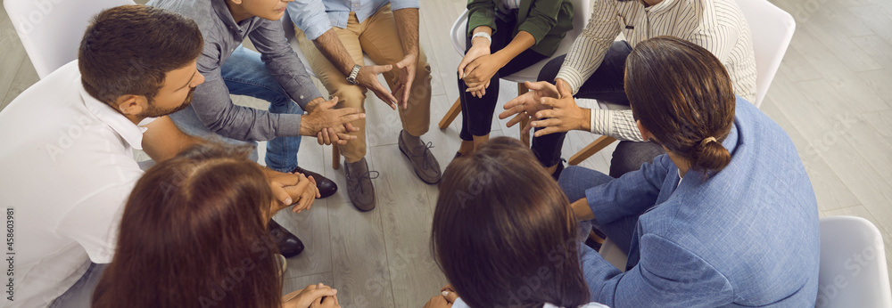 Banner background with business team having discussion in work meeting.  Group of people sitting in circle and having conversation with experienced  business trainer who's sharing advice and expertise Stock Photo | Adobe