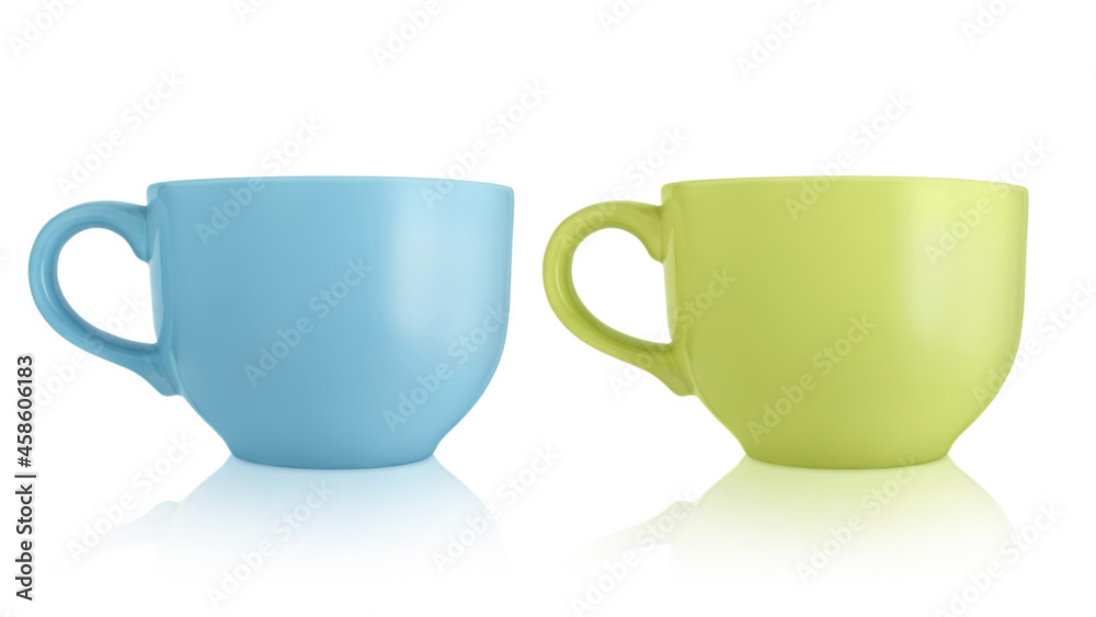 Ceramic cups. Two large empty ceramic mug isolated on white background. Mugs with a handle. Green and blue cups. Ceramic cups. Two large empty ceramic mug isolated on white background. Mugs with a handle. Green and blue cups.