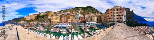 Camogli - beautiful colorful town in Liguria, panorama with traditional fishing boats .popular tourist destination in Italy