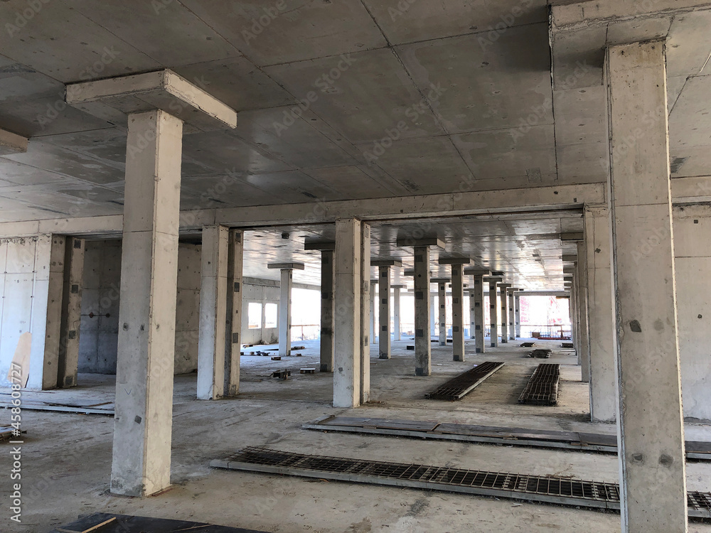 Industrial building under construction. Reinforced concrete pillars and ceiling slab