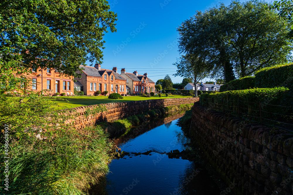 A view of the stream Pow water running through the picturesque village of Powfoot on the Dumfries & Galloway coastline