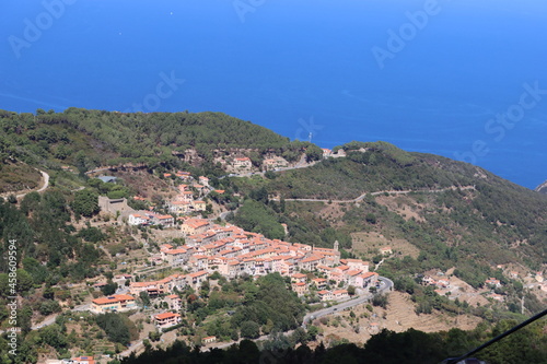 Elba, Italy – September 01, 2021: beautiful places from Elba Island. Aerial view to the island. Little famous villages near the beaches. Summer tourist places. Clouds and blue sky in the background.