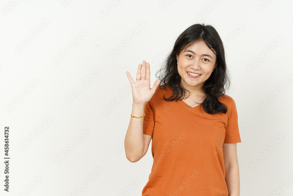 Waving hand Greeting Gesture of beautiful asian woman Wearing orange T-shirt isolated on white background Waving hand Greeting Gesture of beautiful asian woman Wearing orange T-shirt isolated on white background