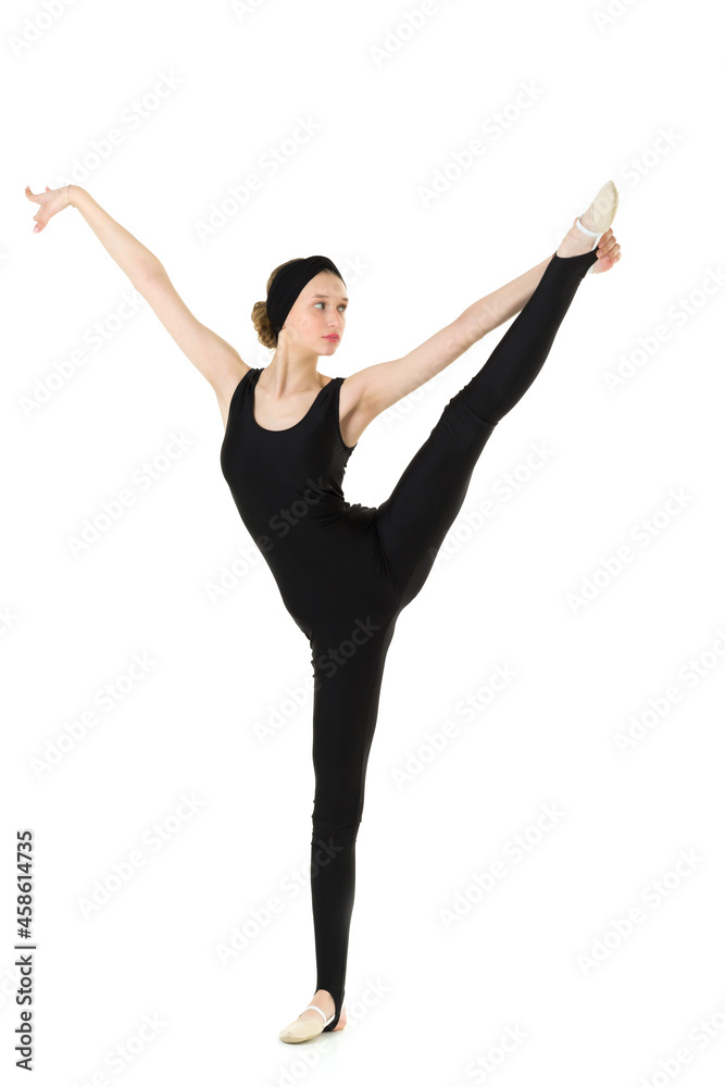 Teenage girl in sports outfit doing vertical split Teenage girl in sports outfit doing vertical split