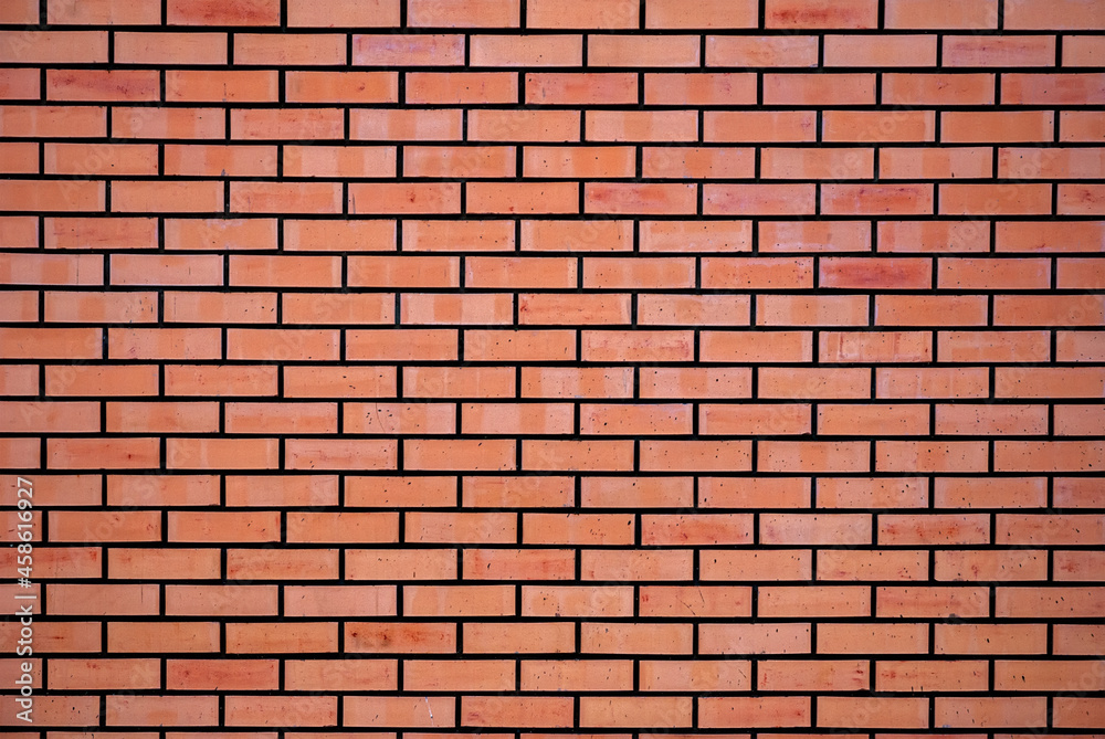 The brick wall is red. Background of bricks.