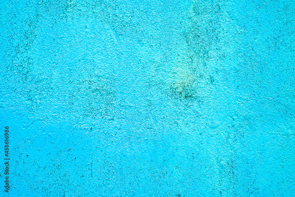 Vivid neon bright blue painted house wall, exterior or interior decoration, with texture and large empty text space. Vivid neon bright blue painted house wall, exterior or interior decoration, with texture and large empty text space.