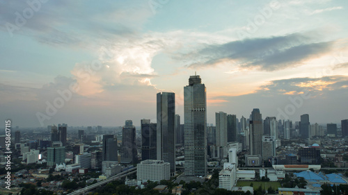 Aerial view of Asia Business concept for real estate - panoramic modern cityscape building bird eye aerial view under sunset and blue bright sky in Jakarta. Jakarta  Indonesia  September 23  2021