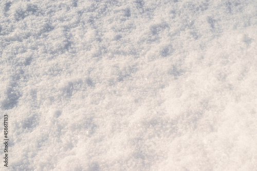 Loose white, sparkling snow. Winter snowy natural background, wallpaper.
