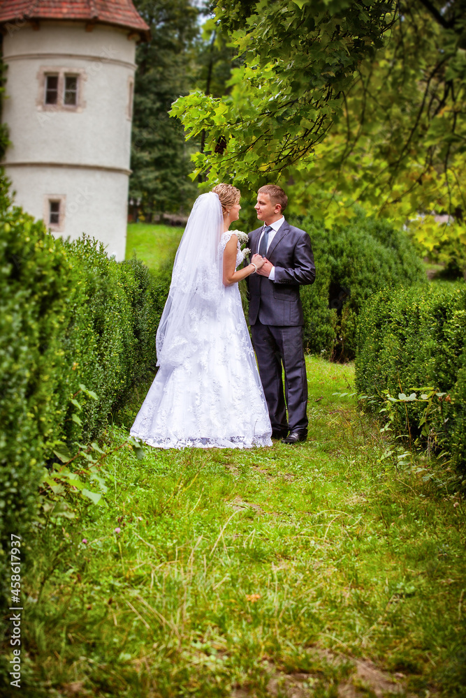 groom with bride on wedding day outdoors