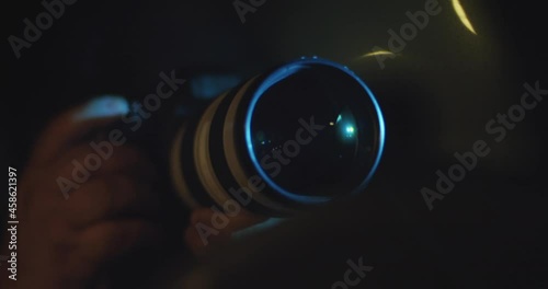 Spy, Paparazzi or Detective in the Car, Shooting On Camera. Night Time Stalking, Long Lens, Secretive Photography