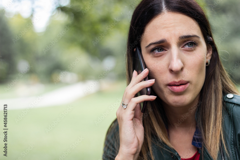 Woman walking and talking on phone Woman walking and talking on phone