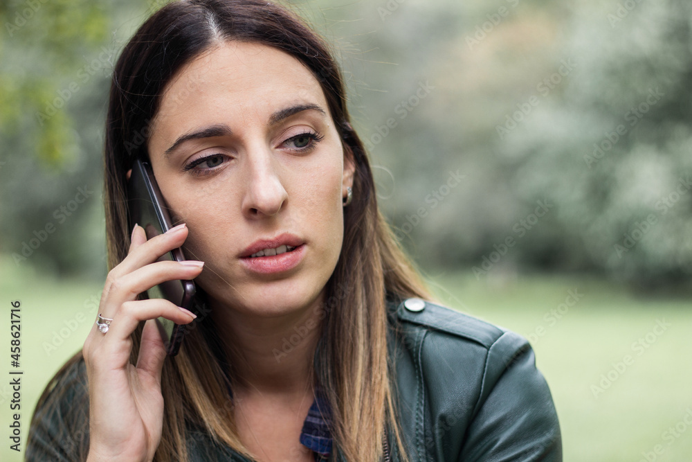 Woman walking and talking on phone Woman walking and talking on phone