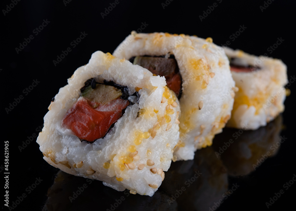 closeup of sushi on a black background with reflect closeup of sushi on a black background with reflect