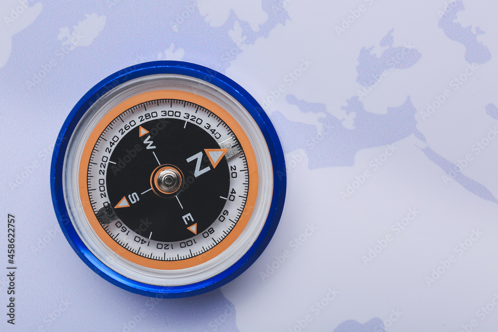 Compass on world map, top view Compass on world map, top view