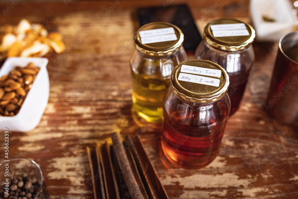 Close up view of multiple ingredients on a wooden table for gin production at gin distillery
