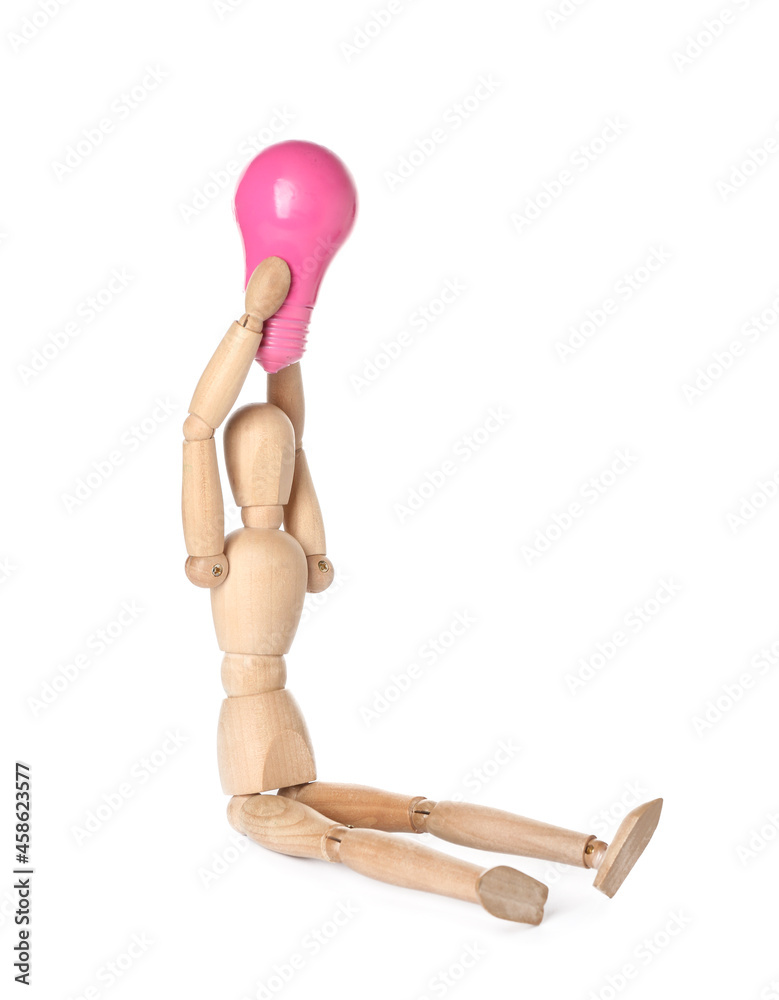 Wooden mannequin with light bulb on white background Wooden mannequin with light bulb on white background