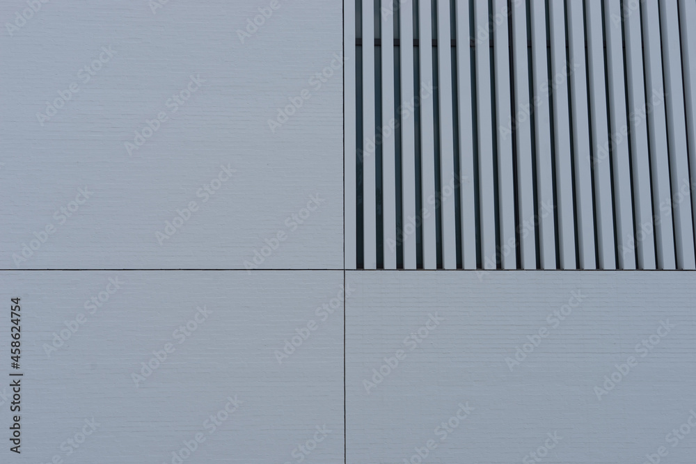 Fototapeta premium Background: closeup of modern spirit architecture, with white metal facing plate and striped window covering
