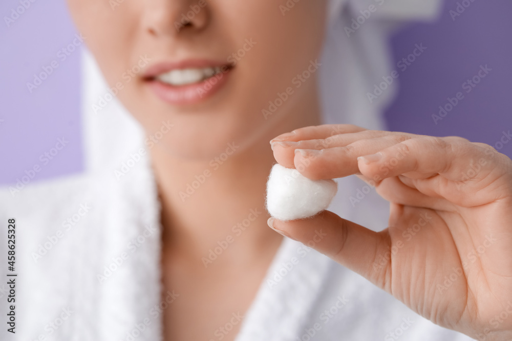Beautiful young woman with cotton wool on color background, closeup Beautiful young woman with cotton wool on color background, closeup