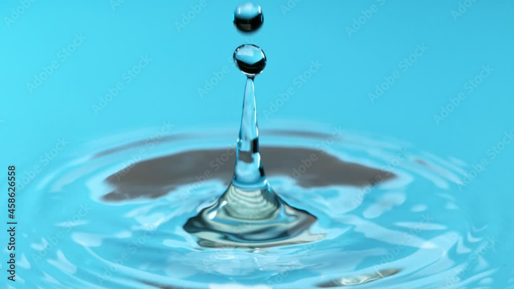 Super slow motion of water drops falling in a row forming an abstract shape, 1000 fps. Super slow motion of water drops falling in a row forming an abstract shape, 1000 fps.