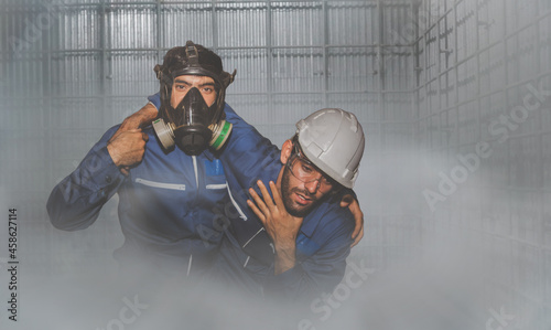 Ammonia (NH3) leak in the factory cold storage industry : Engineer urgently assisted the male technique in the refrigeration room as he could not breathe as quickly as possible before being harmed. photo