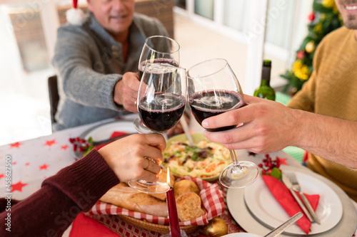 Happy caucasian family toasting at christmas table
