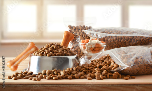 Canvastavla Dog croquettes in sacks and feeder on wooden table front