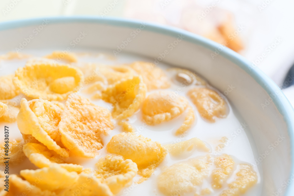 Bowl of tasty cornflakes with milk, closeup Bowl of tasty cornflakes with milk, closeup
