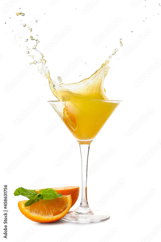 Glass of tasty orange margarita with splashes on white background Glass of tasty orange margarita with splashes on white background