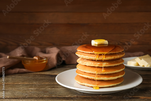 Plate of tasty pancakes wit...
