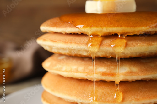 Tasty pancakes with honey a...
