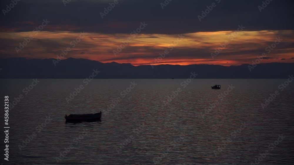Extraordinary View of Beautiful Sunset at Sea, with Small Boats Passing by. Extraordinary View of Beautiful Sunset at Sea, with Small Boats Passing by.