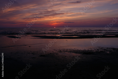 The sun sets in the sea.