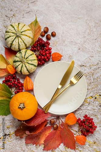 Beautiful table setting with autumn decor on color background