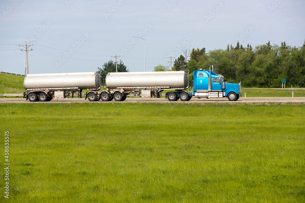Heavy Cargo on the Road. A truck hauling freight along a highway Heavy Cargo on the Road. A truck hauling freight along a highway