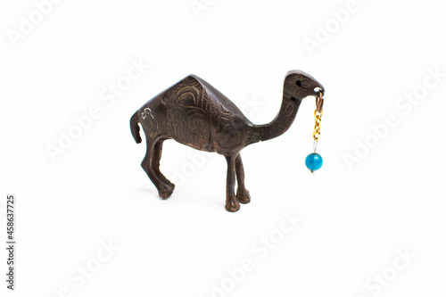 camel souvenir with a bead on a white background.
