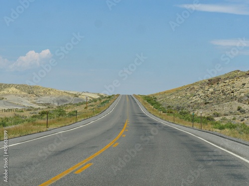 Paved upward road, Wyoming-Montana border landscape