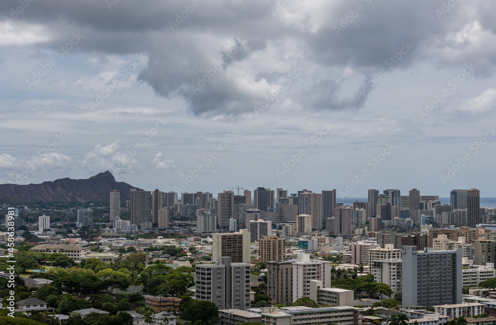 Scenic aerial Honolulu vista with the Diamond Head in the background on a rainy day, Oahu, Hawaii