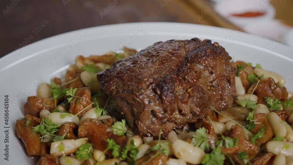 Close Up Food Video Concept Slow motion. White Plate with delicious Beef Food dish. Food preparation footage. Close Up Food Video Concept Slow motion. White Plate with delicious Beef Food dish. Food preparation footage.