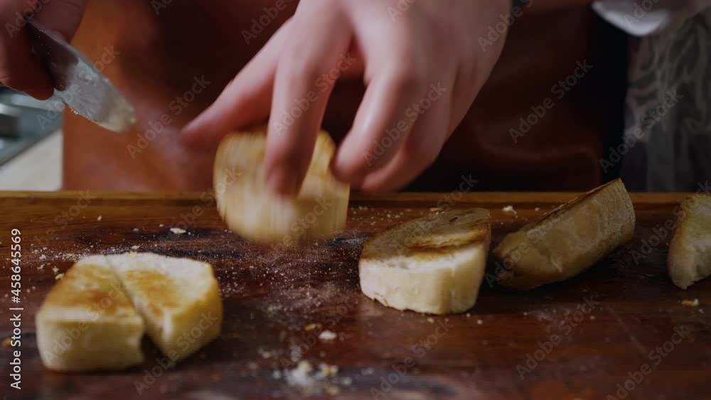 Cutting with a Knife Crusty Artisan Bread. Slow Motion Footage Cutting with a Knife Crusty Artisan Bread. Slow Motion Footage