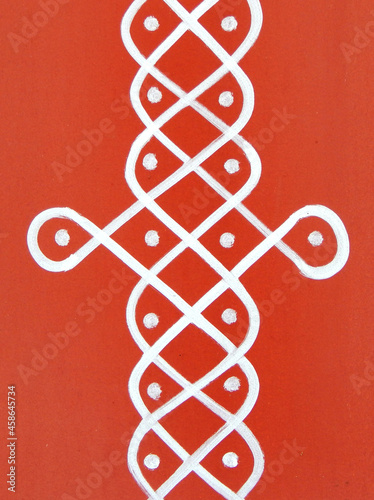  Indian Hindu traditional rangoli drawing on the wall of rural house