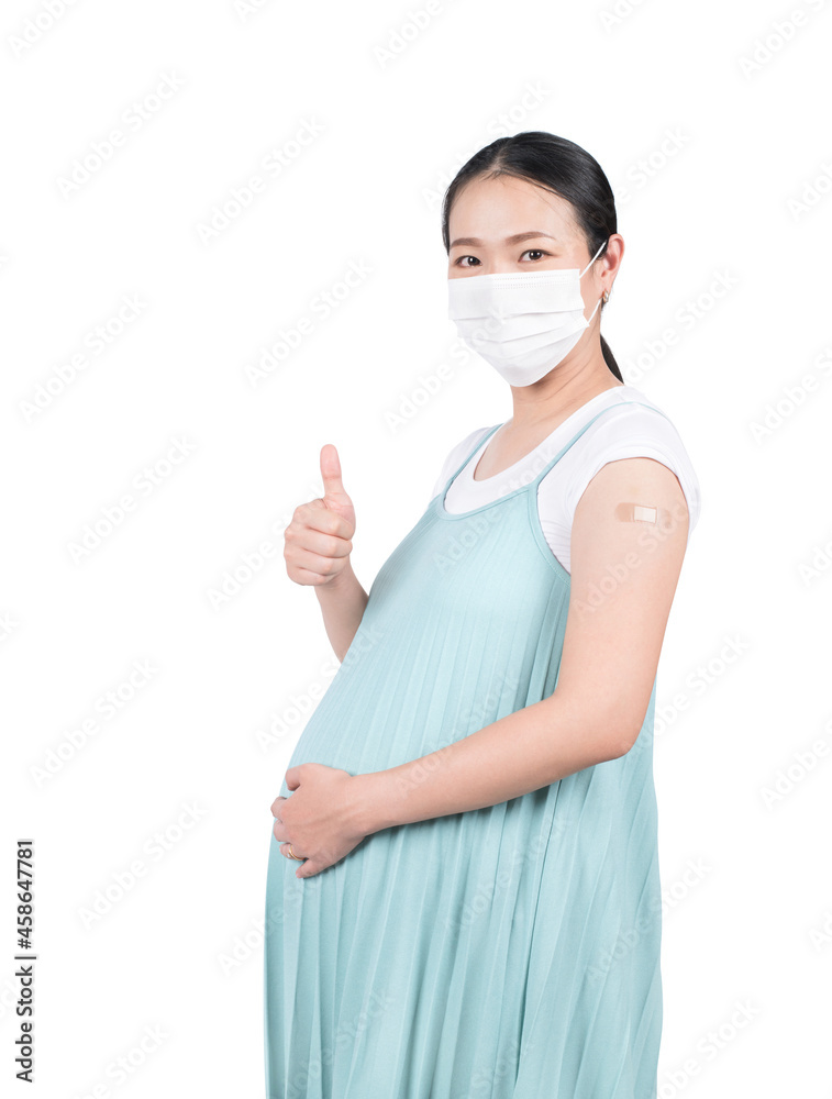 Vaccinated pregnant woman show sight thumb up after getting Covid-19 vaccine injection.