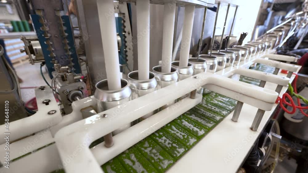 Aluminum beverage cans filled in automated production assembly line, HD Aluminum beverage cans filled in automated production assembly line, HD