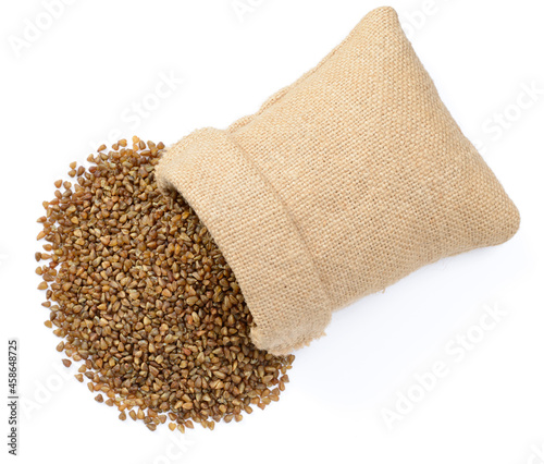 uncooked buckwheat in the sack, isolated on the white background, top view