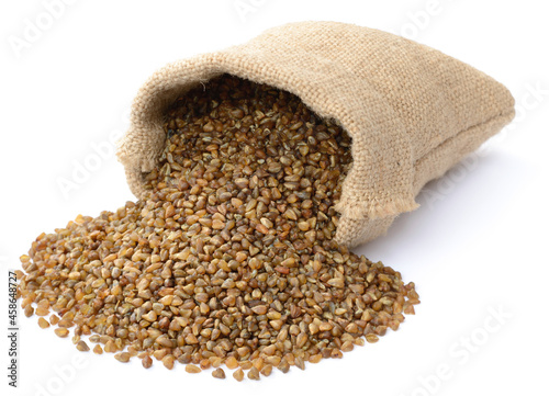 uncooked buckwheat in the sack, isolated on the white background