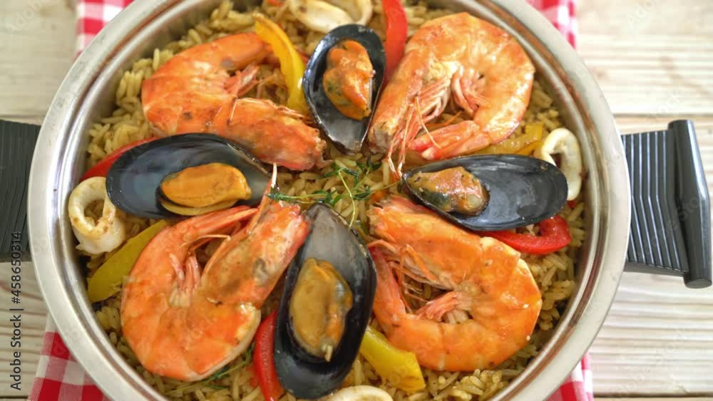 Seafood Paella with prawns, clams, mussels on saffron rice - Spanish food style Seafood Paella with prawns, clams, mussels on saffron rice - Spanish food style