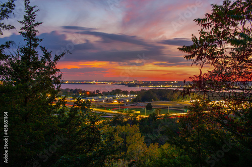 Distant View Of Peoria Illinois From The Woods At Sunset