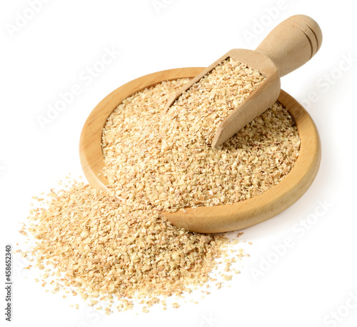raw wheat germ in the wooden bowl, isolated on the white background